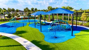 Avenir Clubhouse - Blue and green playground on teal turf
